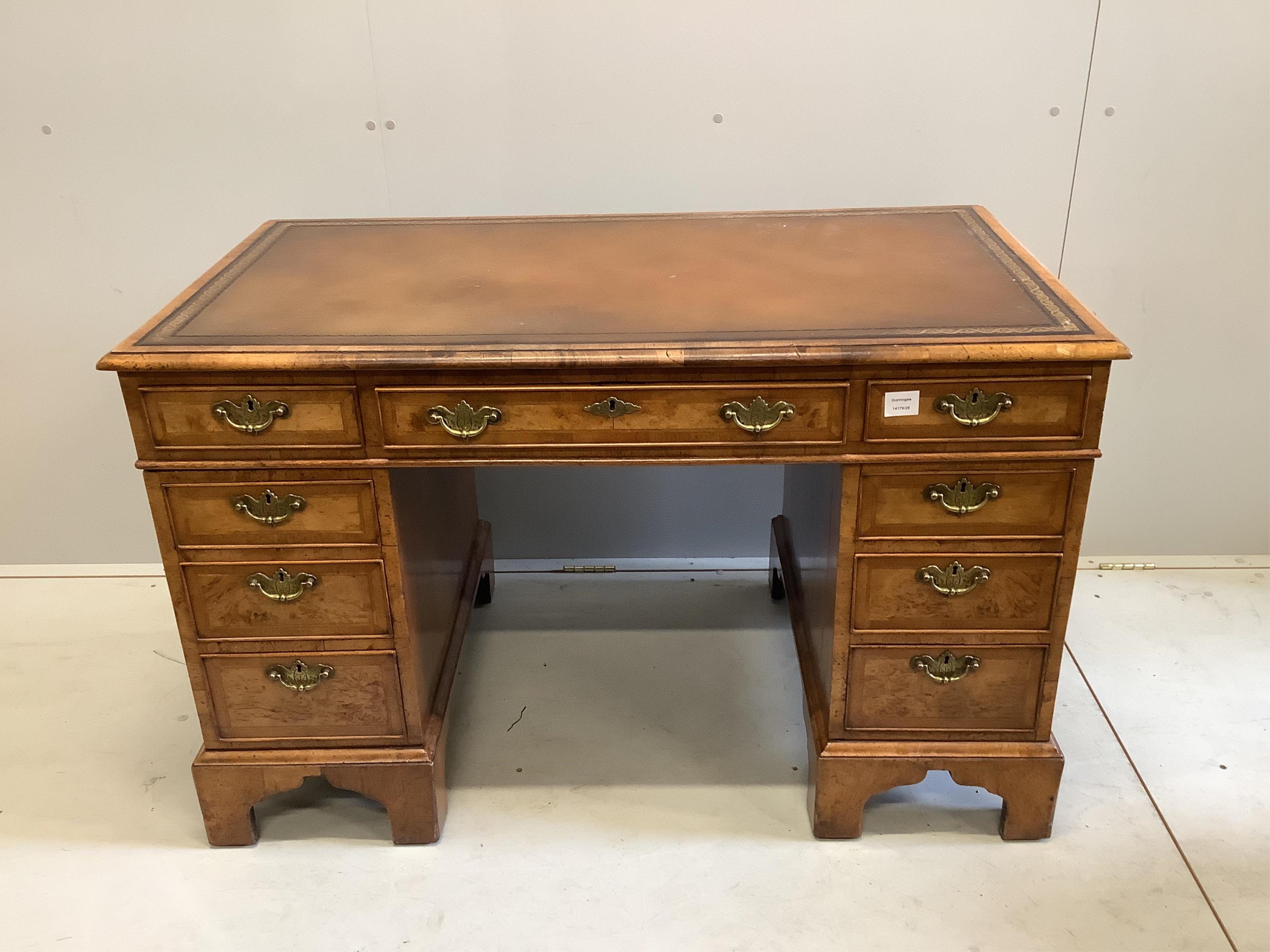 An 18th century style walnut pedestal desk, width 121cm, depth 67cm, height 77cm. Condition - good